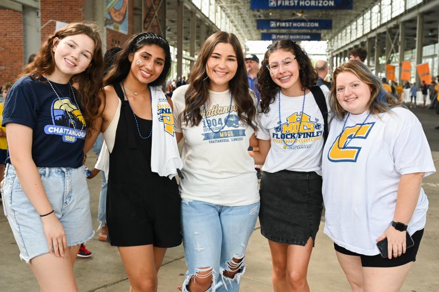 UTC female students at a football game wearing UTC branded clothes