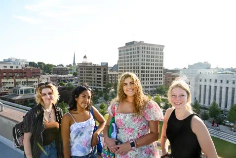 UTC Honors students standing in front of the Chattanooga city skyline